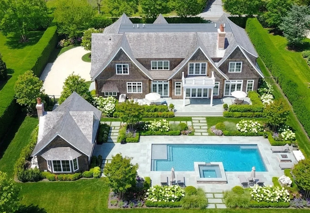 Aerial view of luxury coastal home in Sagaponack NY with pool and manicured grounds