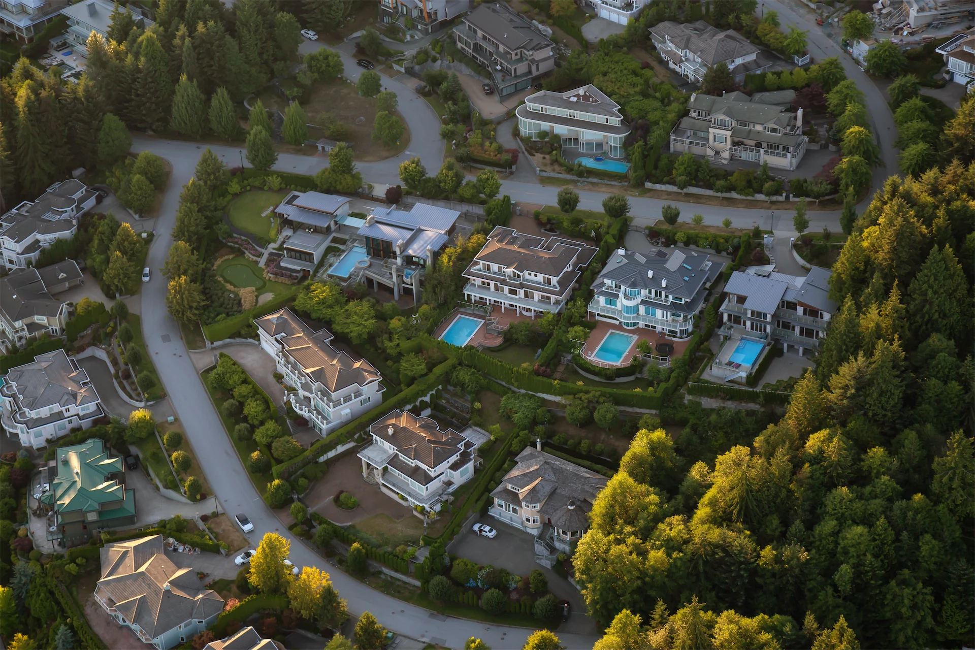 Aerial view of residential properties and surrounding neighborhoods for preconstruction lot and site planning