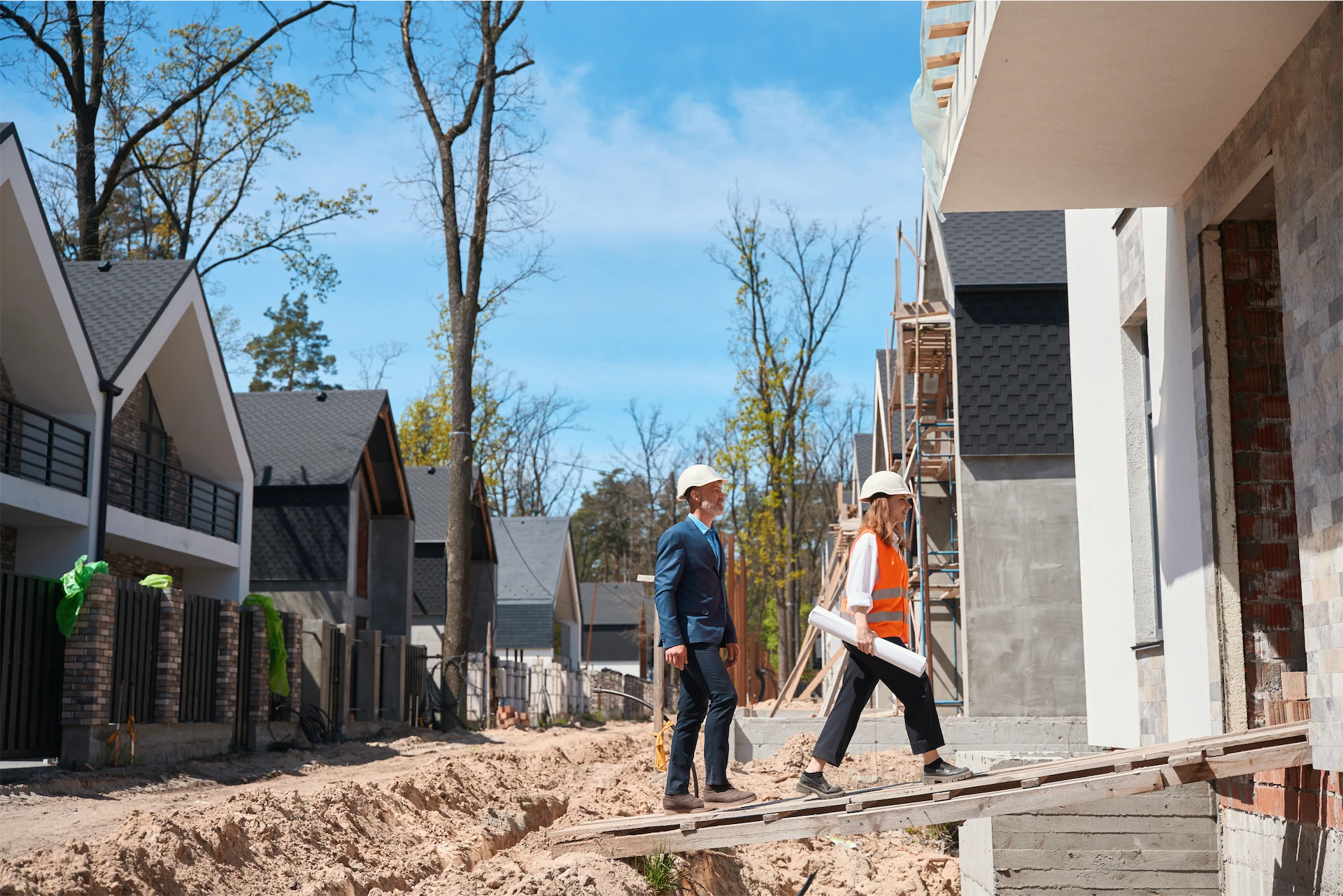 Construction professionals conducting a preconstruction site inspection at a residential development